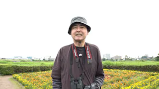 野鳥を見る田中